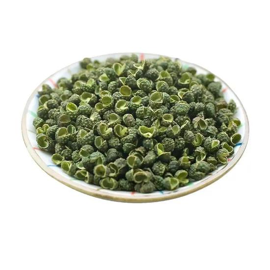 Green Sichuan peppercorns piled in a white plate