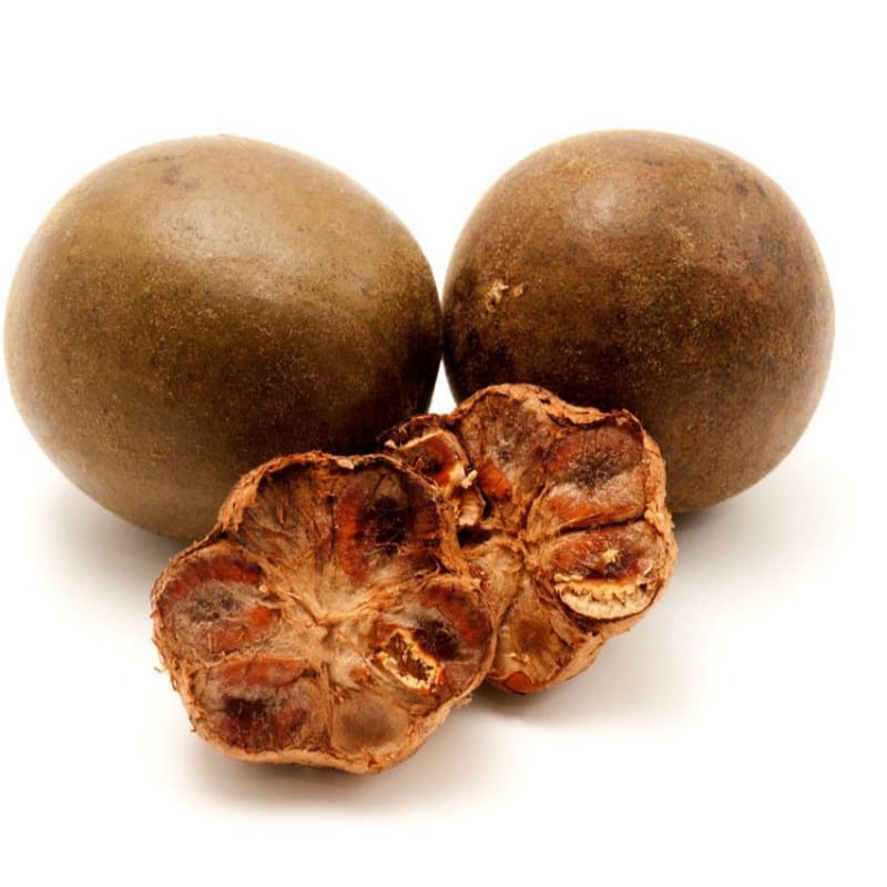 Two whole dried monk fruit and one cracked open showing dried flesh on white background